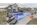 Backyard featuring a large in-ground pool, lounge chairs, gazebo and well-manicured backyard at 4268 Winners Cir, Bargersville, IN 46106