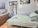 Cozy bedroom features a bed, dresser, and decorative wall art at 5212 Bahia Dr, Indianapolis, IN 46237