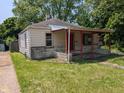 Charming single-Gathering home featuring a covered porch, and a well-maintained lawn at 603 W 33Rd St, Anderson, IN 46013