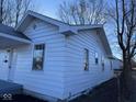 Side exterior view of the home highlighting the windows and the architecture of the home's design at 605 W 10Th St, Muncie, IN 47302