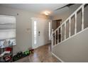 Bright entryway with tile flooring, a staircase, and a front door with sidelights at 6116 Bartley Ct, Indianapolis, IN 46236