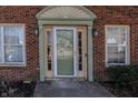 Close up of front door with decorative molding and matching sidelights at 6116 Bartley Ct, Indianapolis, IN 46236