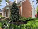 The house has a well landscaped yard and black shutters at 8044 Clymer Ln, Indianapolis, IN 46250