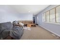 Inviting living room with plush seating, neutral carpet, and natural light from the window with blinds at 8350 E Cr 200 S, Zionsville, IN 46077