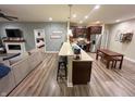 Well-lit kitchen featuring updated stainless steel appliances, bar seating and backyard views at 958 Mesa Ln, Bargersville, IN 46106