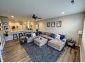 Spacious living room with a cozy seating area and a view into the open concept kitchen at 958 Mesa Ln, Bargersville, IN 46106