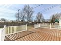 Spacious wooden deck with white railing, perfect for outdoor entertaining and relaxation at 117 W Mckenzie Rd, Greenfield, IN 46140