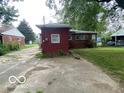 View of the backyard and driveway leading to the back of the home at 1925 N Leland Ave, Indianapolis, IN 46218