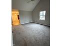 Spacious living room with high ceilings, neutral paint, and plush carpeting at 208 Monroe St, Indianapolis, IN 46229