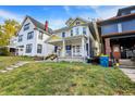 Inviting two-story home with a charming front porch and well-maintained lawn at 3145 N New Jersey St, Indianapolis, IN 46205