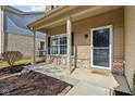 Charming front porch with brick accents and well-maintained landscaping for a welcoming entrance at 5546 W Vistaview Trl, McCordsville, IN 46055