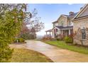 Beautiful home showcasing a well-manicured lawn and circular driveway, perfect for curb appeal at 5895 W 265 N, Columbus, IN 47201