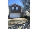 Charming two-story home with brick and siding, featuring a two-car garage and a well-maintained front yard at 6817 Everbloom Ln, Indianapolis, IN 46217