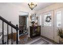 Inviting foyer featuring a view into the dining area, a decorative cabinet, and a patterned rug at 7089 W 150 N, Greenfield, IN 46140