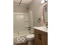 Updated bathroom features a shower-tub combo, modern vanity, and updated fixtures at 1220 E Second St, Greenfield, IN 46140