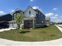 Elegant two-story home with three-car garage, manicured lawn, and lush landscaping at 1256 Turner Trace N Pl, Avon, IN 46123