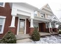 Inviting exterior showcasing the home's address and a covered front porch with stylish columns at 15542 Crofton Pl, Westfield, IN 46074