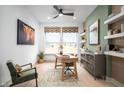 Bright home office with a large window, modern decor, and stylish furnishings at 19868 Chatham Shore Ln, Westfield, IN 46074
