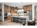 Spacious kitchen with stainless steel appliances, center island, and custom cabinets at 19868 Chatham Shore Ln, Westfield, IN 46074