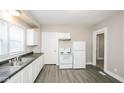 Functional kitchen features modern appliances, white cabinetry, and durable flooring at 2138 N Dexter St, Indianapolis, IN 46202