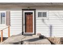 Close up of the front door with address number 4952 on white siding at 4952 Mathews Ave, Indianapolis, IN 46227