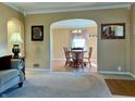 Inviting living room that showcases the seamless transition to a spacious dining area at 5 N High School Rd, Indianapolis, IN 46214