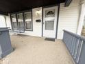 Inviting front porch featuring a porch swing, perfect for relaxing outdoors at 637 N Oakland Ave, Indianapolis, IN 46201