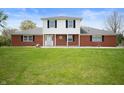 Charming two-story home featuring a well-maintained lawn and inviting curb appeal at 6629 N 600 W, Fairland, IN 46126