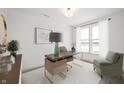 Bright home office featuring neutral walls, contemporary furnishings, and a large window for natural light at 780 James William Ln, Westfield, IN 46074