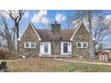 Charming stone home featuring a unique chimney design and two entry doors at 8937 W 800 N, Indianapolis, IN 46259