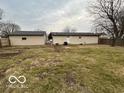 Large, grassy backyard with a detached garage and partially fenced perimeter at 1007 N 10Th St, Elwood, IN 46036