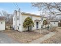 Split-level home with blue front door, mature trees, and detached garage at 10483 126Th St, Fishers, IN 46038