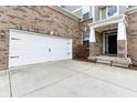 Attached two car garage with painted white doors at 14402 Wolverton Way, Fishers, IN 46037