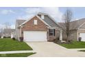 Well-maintained home with a two-car garage and a freshly landscaped front yard at 16613 Grappa Trl, Fishers, IN 46037