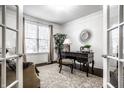 Cozy office space with natural light, a classic desk, and a comfortable seating area at 2000 Haverford St, Carmel, IN 46032