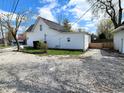 The exterior showcases a well-maintained backyard with ample space and a detached garage at 498 Johnson Ave, Franklin, IN 46131