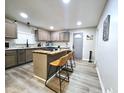 Spacious kitchen featuring an island with seating, modern cabinets, and sleek countertops at 498 Johnson Ave, Franklin, IN 46131