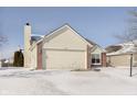 The two-car garage and brick accents highlight the exterior of this inviting Gathering home at 12222 Split Granite Dr, Fishers, IN 46037