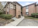 A charming brick condo with a sidewalk leading to the entrance and mature shrubbery at 2207 Rome Dr # B, Indianapolis, IN 46228