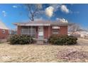 Charming single-story brick house with a covered porch and landscaped bushes in the front yard at 3842 Priscilla Ave, Indianapolis, IN 46226