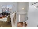 Inviting entryway featuring hardwood floors, a white staircase and a view of the front door at 544 Hunters Trl, Greenwood, IN 46142