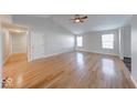 Spacious living room with vaulted ceiling and gleaming hardwood floors and abundant natural light at 6608 Rushing, Noblesville, IN 46062