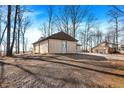 Beautiful one-story home with a brick exterior, attached garage, and a wooded front yard at 6775 W Woodcrest Dr, Greenfield, IN 46140