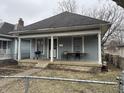 Charming home featuring a cozy front porch for relaxing and entertaining outdoors at 712 Lynn St, Indianapolis, IN 46222