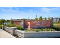 Stone entrance sign to the Gramercy West community featuring manicured flower beds at 754 Astor Ln, Carmel, IN 46032