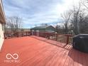 Large wooden deck with a red stain, offering ample space for outdoor entertaining and grilling at 7811 W 700 S, Jamestown, IN 46147