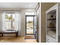 Inviting entryway with wood floors, natural light, and closet for storage at 9543 Brightwell Dr, Indianapolis, IN 46260