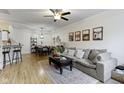 Comfortable living room with wood floors, a ceiling fan, and an area rug at 9543 Brightwell Dr, Indianapolis, IN 46260