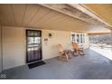 Inviting covered porch with two rocking chairs, offering a cozy spot to relax and enjoy the outdoors at 1001 N 750 W, Bargersville, IN 46106