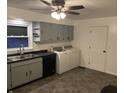 Efficient kitchen area complete with stainless steel sink, grey cabinets and matching appliances at 2070 E 100 S, Lebanon, IN 46052